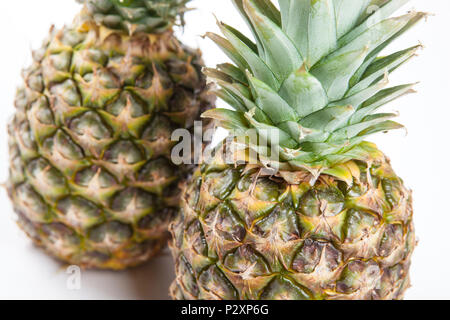 two big pineapples on a white background closeup Stock Photo