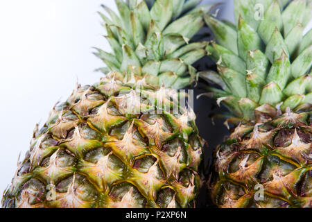 two big pineapples on a white background closeup Stock Photo