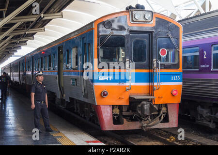 Bangkok, Thailand-19th March 2018: Guard standing by diesel engine, Hua Lamphong station. This is the main railway station. Stock Photo