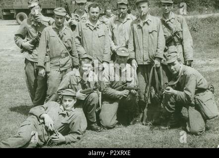THE CZECHOSLOVAK SOCIALIST REPUBLIC - CIRCA 1970s: Retro photo shows young men (soldiers)  pose outdoors. Soldiers hold sub-machine guns. Vintage photography. Stock Photo