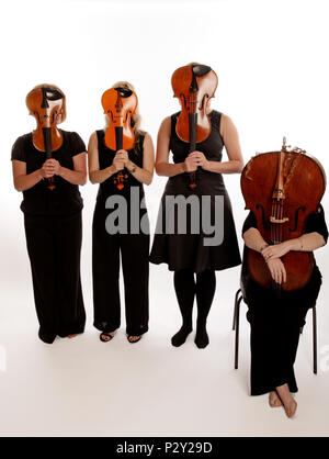 string quartet, all hiding behind their instruments.- generic Stock ...