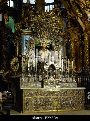 Main altar of the Cathedral of Santiago de Compostela. A bejeweled medieval stone statue of St. James (12th century). Remodeled, sitting on a silver chair and covered by a silver enclosure. Santiago de Compostela Cathedral. Santiago de Compostela, Province of La Coruña, Galicia, Spain. Stock Photo