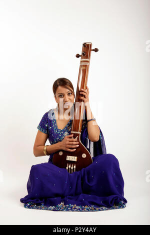 Tanpura, Indian string instrument in playing position Stock Photo