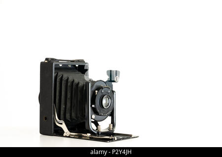 Black vintage folding bellows film camera isolated against a white background Stock Photo