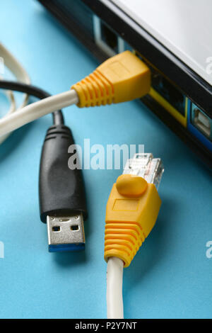 network cables - modem router - internet connection - closeup Stock Photo