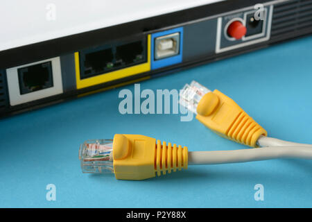 network cables - modem router - internet connection - closeup Stock Photo