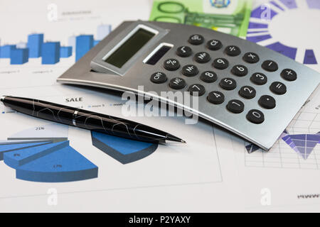 Pen, calculator and euros are on the charts. Business background Stock Photo