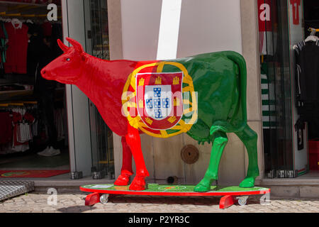 TAVIRA, PORTUGAL : 5th  MAY, 2018 - Close up of a painted sculpture of cow with the Portuguese flag, in the streets of Tavira city. Stock Photo