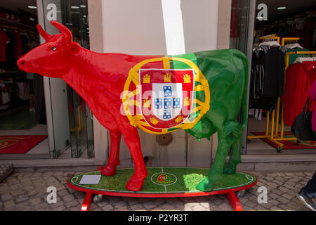 TAVIRA, PORTUGAL : 5th  MAY, 2018 - Close up of a painted sculpture of cow with the Portuguese flag, in the streets of Tavira city. Stock Photo
