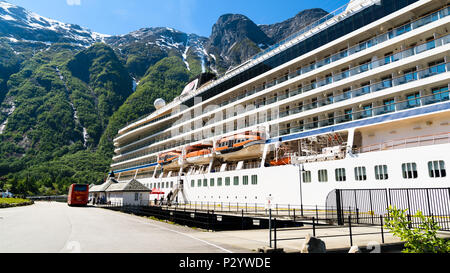 Eidfjord, Norway - May 21, 2018: Travel documentary of everyday life and place. The luxury cruise ship Viking Sun moored in the village. Passengers le Stock Photo