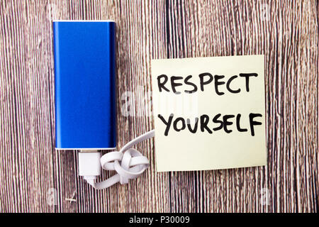 Words Respect Yourself are written on paper present next to Energy bank.importance of dignity and worth for himself is mentioned in picture. Stock Photo