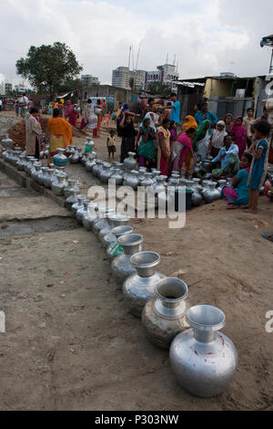 Stranded Pakistanis in Bangladesh of Kurmitola Bihari Camp at Mirpur collect drinking water in a queue. Dhaka, Bangladesh. Stock Photo