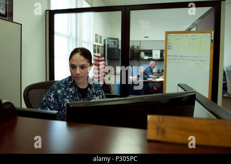 160816-N-AI605-666 PEARL HARBOR (July 25, 2016) - Petty Officer 1st Class Mariana Aragon processes the orders for over 150 Reservists who are participating in the Rim of the Pacific Exercise 2016. Twenty-six nations, more than 40 ships and submarines, more than 200 aircraft and 25,000 personnel participated in RIMPAC from June 30 to Aug. 4, in and around the Hawaiian Islands and Southern California. The world's largest international maritime exercise, RIMPAC provides a unique training opportunity that helps participants foster and sustain the cooperative relationships that are critical to ensu Stock Photo