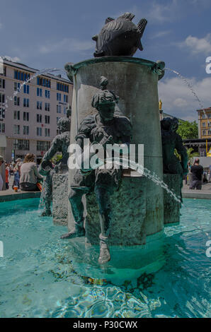 The Fish Fountain, or as it is called in Germen, Fischbrunnen, is a small fountain at the North-East corner of Marienplatz. Stock Photo