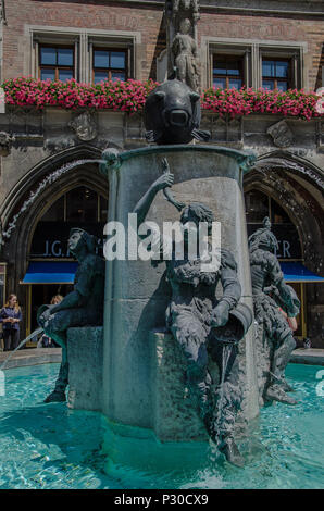 The Fish Fountain, or as it is called in Germen, Fischbrunnen, is a small fountain at the North-East corner of Marienplatz. Stock Photo