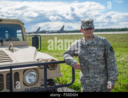 U.S. Army Spc. Angel Mendoza, 4th Space Company, 1st Battalion, 1st Space Brigade, assigned as a space aggressor operator to the 527th Space Aggressor Squadron, Schreiver Air Force Base, Colo., breaks from operating a GPS interference system Aug. 8, 2016, during RED FLAG-Alaska 16-3, at Eielson Air Force Base, Alaska. Mendoza is the first Soldier ever to integrate into the primarily U.S. Air Force mission of training joint and multilateral forces on GPS interference by enemy forces. (U.S. Air Force photo by Staff Sgt. Shawn Nickel) Stock Photo