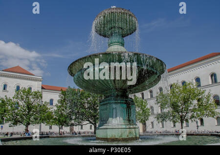 Geschwister-Scholl-Platz is a short semi-circular plaza located in front of the main building of the Ludwig Maximilian University of Munich. Stock Photo