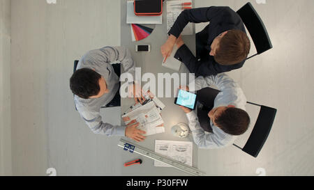 Team of architects working on construction plans. Top view Stock Photo