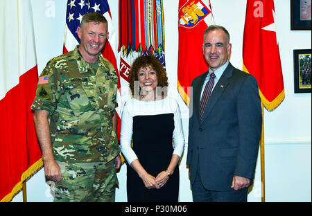 (From Left) Major General Joseph P. Harrington, commanding general of U.S. Army Africa, Dr. Dell McMullen, Department of Defense Education Activity Europe Director, and Mr. Michael Formica, Region Director for Installation Management Command Europe, pose for a photo in the USARAF Commander's office at Caserma Ederle in Vicenza, Italy, August 17, 2016. (Photo by Visual Information Specialist  Antonio Bedin/released) Stock Photo