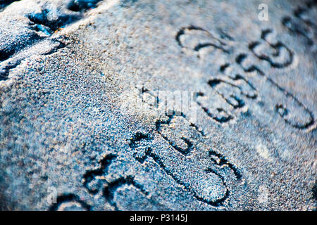 Old mysterious ancient Khmer language on the wall, Cambodia Stock Photo