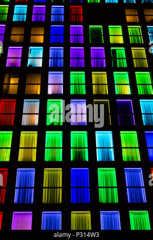 Colored windows texture. Windows illuminated by neon lights background ...