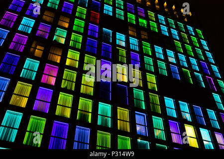 Colored windows texture. Windows illuminated by neon lights background ...