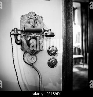Old fashioned telephone at the National Trust's Dunham Massey Hall near Altrincham Cheshire Stock Photo