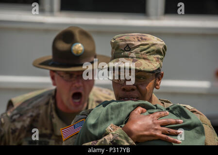 New Soldiers arriving for their first day of Basic Combat Training, Aug. 19, with Company F, 1st Battalion, 34th Infantry Regiment on Fort Jackson, S.C. are 'welcomed' by drill sergeants from both the U.S. Army and U.S. Army Reserve. The reserve drill sergeants are from the 98th Training Division  (IET), 108th Training Command (Initial Entry Training) currently fulfilling their 29-day annual training commitment. (U.S. Army Reserve photo by Sgt. 1st Class Brian Hamilton/ released) Stock Photo