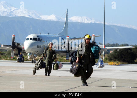 Bay, Crete, Greece (Mar. 14, 2003) -- Patrol Squadron Eight (VP-8) Combat Air Crew (CAC) 2 members walk away from their 'Fighting Tiger' P-3C Orion aircraft after returning from a mission. VP-8, home ported at NAS Brunswick, Maine, is currently deployed to the Mediterranean theater with detachments at Naval Air Station Sigonella, Sicily and Naval Support Activity Souda Bay.  The P-3C is a land-based, long-range, anti-submarine warfare (ASW) patrol aircraft.  It has advanced submarine detection sensors and can carry a mixed payload of weapons internally and on wing pylons. Stock Photo