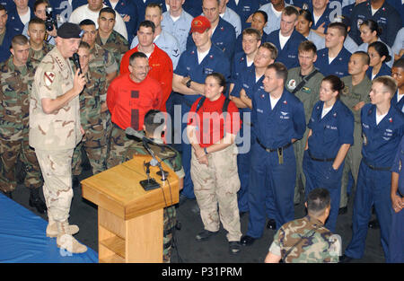 sea aboard USS John C. Stennis (CVN 74) Dec. 25, 2001- Christmas Day, General Tommy R. Franks, Commander in Chief, United States Central Command addresses Sailors and Marines to the ship and her embarked Carrier Air Wing Nine (CVW-9).  General Franks made the Christmas day visit to Stennis to personally deliver his appreciation to the ship's officers and crew for their part in supporting Operation Enduring Freedom. Stock Photo