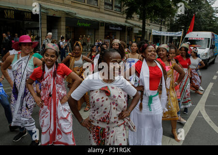 Frankfurt, Germany. 16th June, 2018. Malagasy women dance in the parade, wearing traditional clothes from Madagascar. Thousands of people participated and watched the 2018 Parade der Kulturen (Parade of Cultures), organised by the Frankfurter Jugendring (Frankfurt Youth Council). The parade with participants from over 40 different groups of expat and cultural organisations showcased the cultural diversity of Frankfurt. Credit: Michael Debets/Pacific Press/Alamy Live News Stock Photo