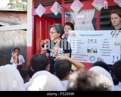 Medical and volunteer personnel participate in Pacific Partnership 2016 at Pasar Laban Elementary School in Padang, Indonesia, on August 23, 2016. The program educates over 200 children on oral hygiene, hydration, and exercise. The event involves USNS Mercy (T-AH 19), Project Hope, and partner nations collaborating with local organizations for disaster response, civil engineering projects, and health promotion, emphasizing international cooperation, humanitarian assistance, and community outreach. Stock Photo