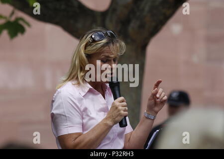 Frankfurt, Germany. 17th June 2018. Heidi Mund addresses the rally. Around 50 right-wing protesters followed the call of Heidi Mund, the former organiser of the FRAGIDA protest in Frankfurt, to use the newly styled 'Tag der Patrioten' (Day of the Patriots), to protest against the government and refugees outside the St. Paul's Church in Frankfurt, a symbol for German Democracy. The protest was part of a larger movement of different right-wing organisations to change the former Day of German Unity (17. June) to a Day of the Patriots in several German cities. The protest was hassled by around 300 Stock Photo