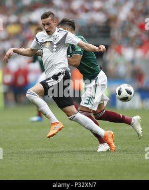 Moscow, Russia. 17th June, 2018. Julian Draxler (L) of Germany vies with Carlos Salcedo of Mexico during a group F match between Germany and Mexico at the 2018 FIFA World Cup in Moscow, Russia, June 17, 2018. Credit: Cao Can/Xinhua/Alamy Live News Stock Photo