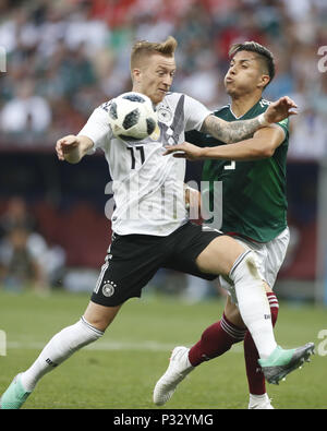 Moscow, Russia. 17th June, 2018. Marco Reus (L) of Germany vies with Carlos Salcedo of Mexico during a group F match between Germany and Mexico at the 2018 FIFA World Cup in Moscow, Russia, June 17, 2018. Credit: Cao Can/Xinhua/Alamy Live News Stock Photo