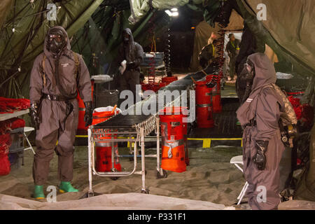 Soldiers with the 172nd Hazard Response Company from Fort Riley, Kansas prepare for a decontamination training exercise August 25, 2016 at Fort Hood, Texas during Sudden Response 16, a weeklong training event for various units within Joint Task Force Civil Support, a rapidly deployable force of more than 5,000 service members from across the country who are specially trained and equipped to provide life-saving assistance in the event of chemical, biological, radiological or nuclear disasters in the U.S. The training exercise included 200 civilian role players who acted as injured survivors of  Stock Photo