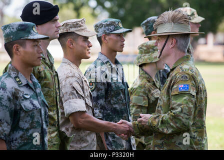 Australian Army officer Brigadier Damian Cantwell, AM, Deputy Commander 2nd Division, shakes hands with US Marine Corps marine during the Exercise Kowari opening ceremony at Larrakeyah Barracks in Darwin, Northern Territory, on 26 August 2016. Kowari is an Australian army-hosted survival skills exercise designed to increase defense cooperation between forces from the U.S., Australia and China. (Australian Defence Force photo by Cpl. Jake Sims) Stock Photo