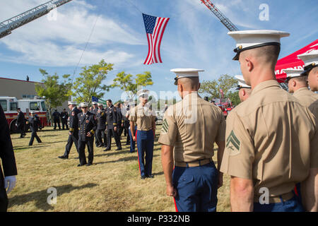 Community members, Reserve Marines, veterans, firefighters, and police  officers gather at Marine Corps Reserve Center Brooklyn for a 9/11 Tribute  honoring Sgt. Maj. Michael S. Curtin and Gunnery Sgt. Matthew D. Garvey.