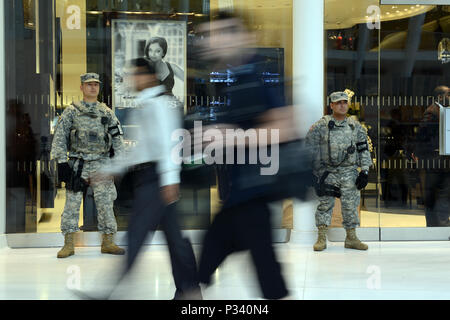 Sgt. Erislav J. Astanov and Spc. Saul Revatta, both part of Joint Task Force Empire Shield, stand guard in a shopping mall and commuter hub, known as 'the Oculus,' located at the World Trade Center complex in New York City, Aug. 16, 2016. Their mission is to detect and deter terrorism Stock Photo