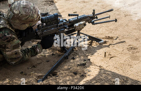 U.S. Army soldiers shoot rounds from an M1A1 Abrams battle tank during ...