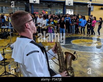 MANILA, Republic of the Philippines (June 12, 2018) Musician 3rd Class Ian Cooper, assigned to the U.S. 7th Fleet Band, Far East Edition, performs for students of the Don Bosco Street Children Village in Manila as part of a U.S. 7th Fleet theater security cooperation (TSC) patrol. More than 40 Sailors and Marines from U.S. 7th Fleet staff are currently embarked on USNS Millinocket (T-EPF 3) supporting a range of senior level engagements and community outreach events. (U.S. Navy photo by Mass Communication Specialist 1st Class Chris Krucke/Released) Stock Photo