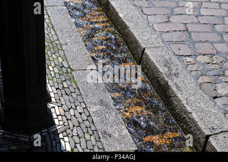 Bächle, water-filled runnels in old town of Freiburg, a city in black forest in Germany Stock Photo