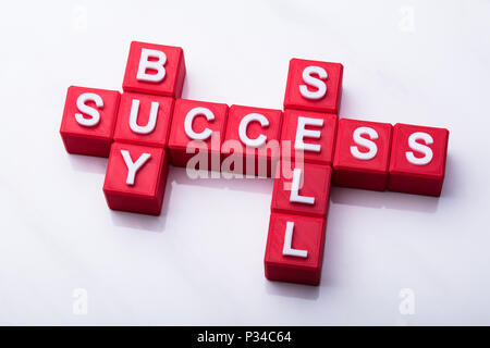 Sell And Success Crossword Words On White Background Stock Photo