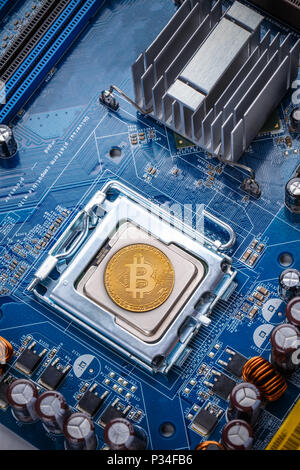 Bitcoin concept - Printed circuit board with bitcoin processor and microchips Stock Photo