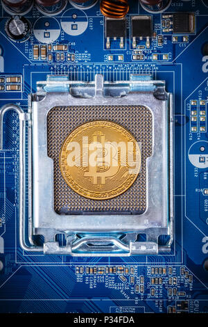 Bitcoin concept - Printed circuit board with bitcoin processor and microchips Stock Photo