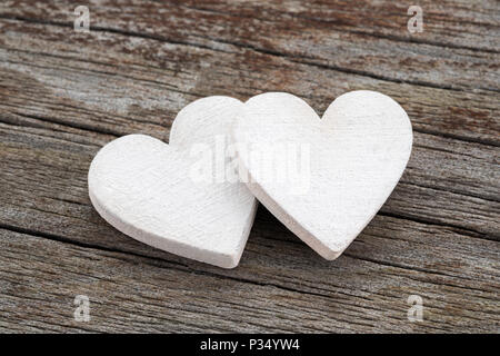 Two hearts on old wooden background Stock Photo