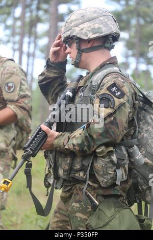 U.S. Army Reserve Sgt. Benjamin Moran, an Army Reserve musician from Granville, Ohio, with the 338th United States Army Reserve Command Band, 88th Readiness Division, competes in the tactical combat casualty care event at the 2018 U.S. Army Reserve Best Warrior Competition at Fort Bragg, North Carolina, June 14, 2018. Today, U.S. Army Reserve Soldiers give everything they have to push past their limits and finish the last day of events in the 2018 U.S. Army Reserve Best Warrior Competition. (U.S. Army Reserve photo by Pfc. Tierra Sims)(Released) Stock Photo