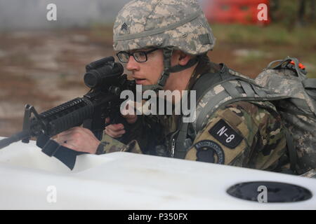 U.S. Army Reserve Sgt. Benjamin Moran, an Army Reserve musician from Granville, Ohio, with the 338th United States Army Reserve Command Band, 88th Readiness Division, competes in the tactical combat casualty care event at the 2018 U.S. Army Reserve Best Warrior Competition at Fort Bragg, North Carolina, June 14, 2018. Today, U.S. Army Reserve Soldiers give everything they have to push past their limits and finish the last day of events in the 2018 U.S. Army Reserve Best Warrior Competition. (U.S. Army Reserve photo by Pfc. Tierra Sims)(Released) Stock Photo