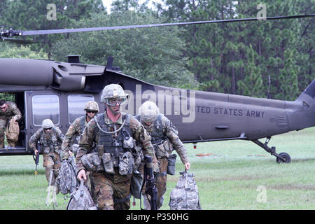 U.S. Army Soldiers from the 365th Transportation Detachment take cover ...