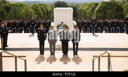 (From left to right) Maj. Gen. Michael L. Howard, commanding general, Joint Force Headquarters – National Capital Region and the U.S. Army Military District of Washington, Dr. Mark T. Esper, Secretary of the Army; Gen. Mark A. Milley, Chief of Staff of the Army; and Sgt. Maj. Daniel A. Dailey, Sergeant Major of the Army, stand at attention in front of Tomb of the Unknown Soldier during an Army Full Honor Wreath Laying ceremony at the Tomb of the Unknown Soldier, Arlington, Va., June 14, 2018. The wreath-laying ceremony celebrated the Army’s 243rd birthday.  (U.S. Army photo by Joseph B. Lawson Stock Photo